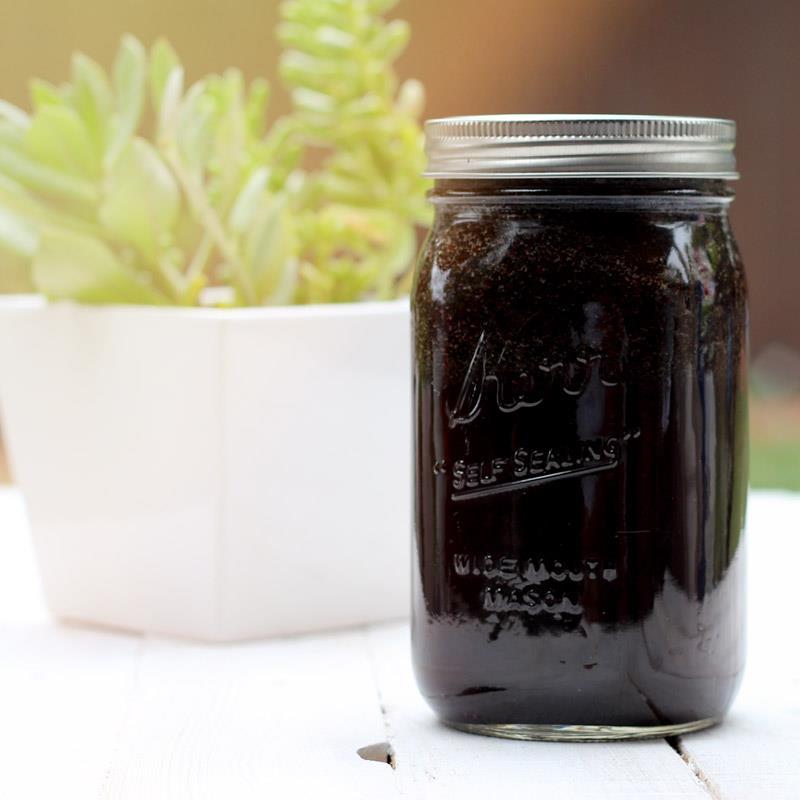 Jar of Cold Brew coffee next to a succulent plant